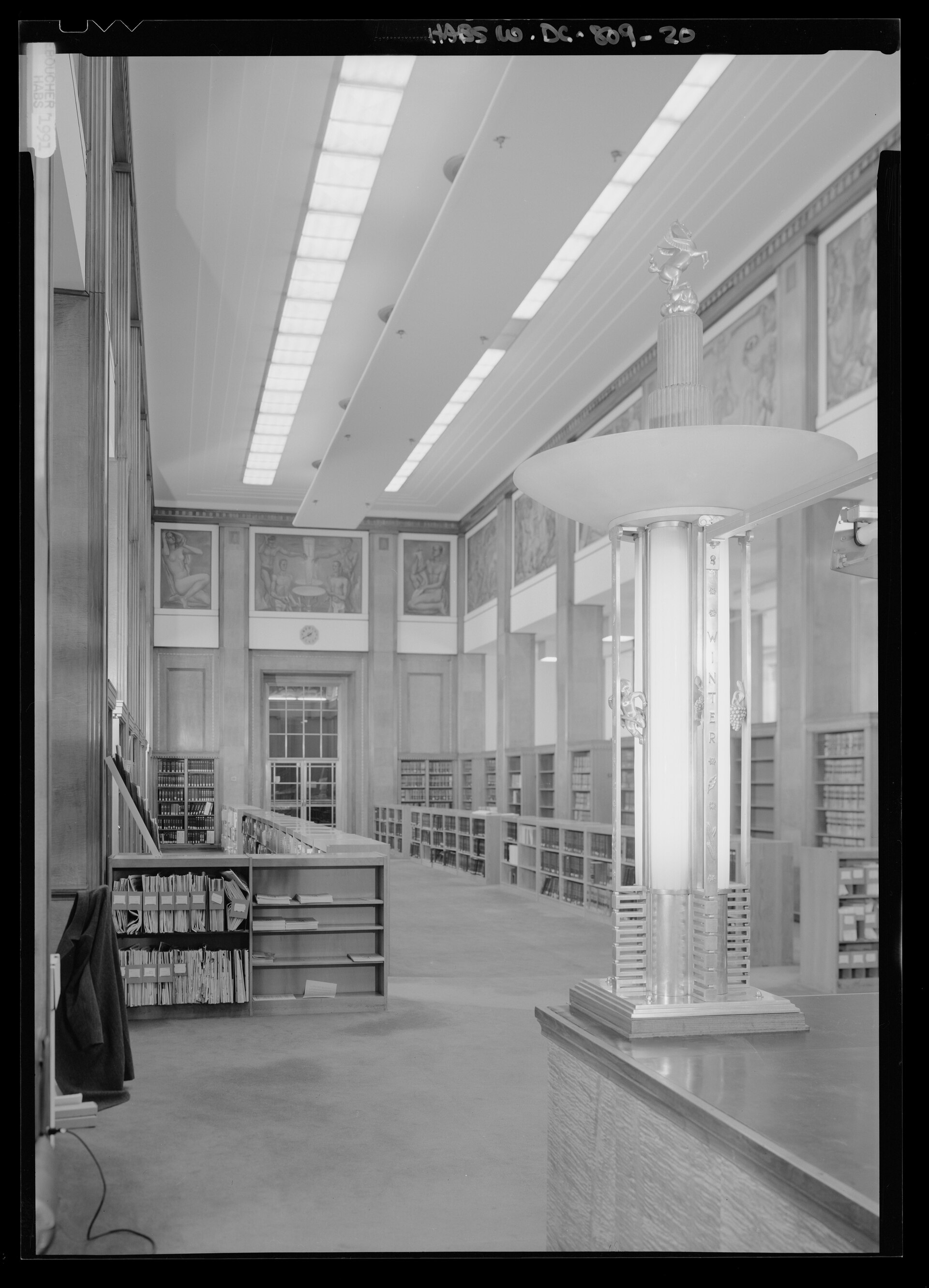 Interior view, law library (note one of aluminum lamps designed by Jennwein is in the foreground; the murals were painted by Maurice Sterne) - United States Department of Justice, Constitution Avenue between Ninth and Tenth Streets, Northwest, Washington, District of Columbia, DC
